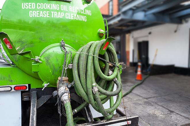 a service truck pumping grease from a restaurant's grease trap in Bouse, AZ